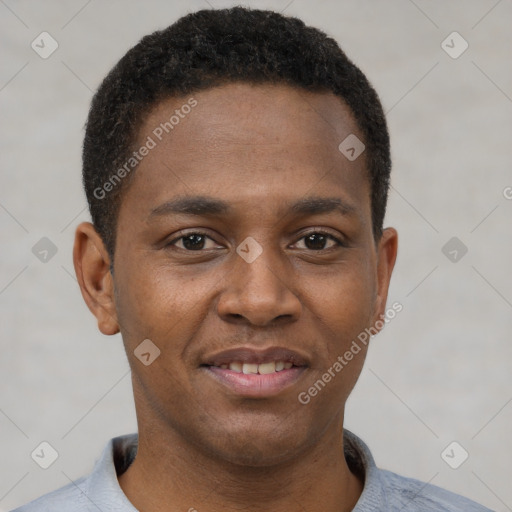 Joyful black young-adult male with short  brown hair and brown eyes