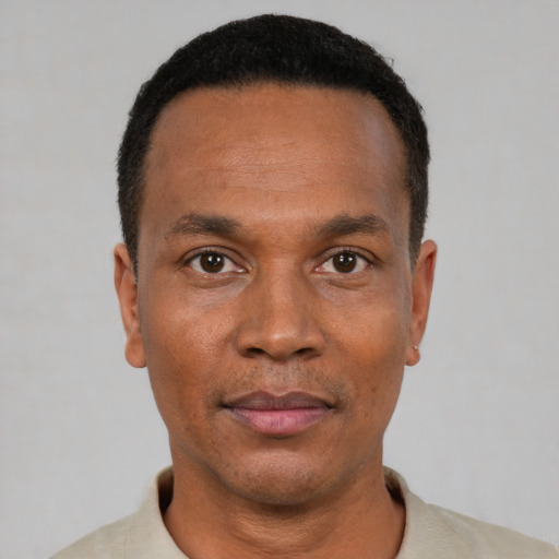 Neutral black adult male with short  black hair and brown eyes