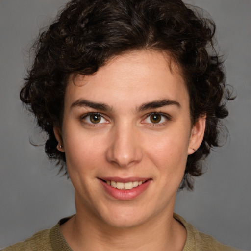 Joyful white young-adult female with medium  brown hair and brown eyes