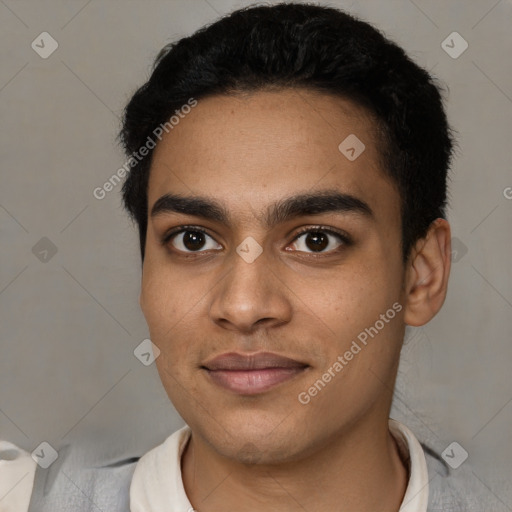 Joyful latino young-adult male with short  black hair and brown eyes