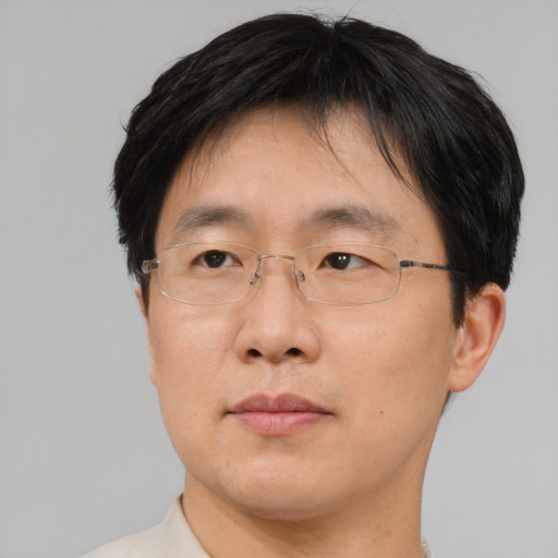 Neutral asian adult male with short  brown hair and brown eyes