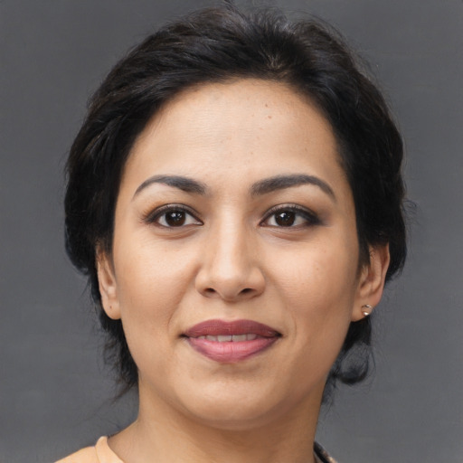 Joyful asian young-adult female with medium  brown hair and brown eyes