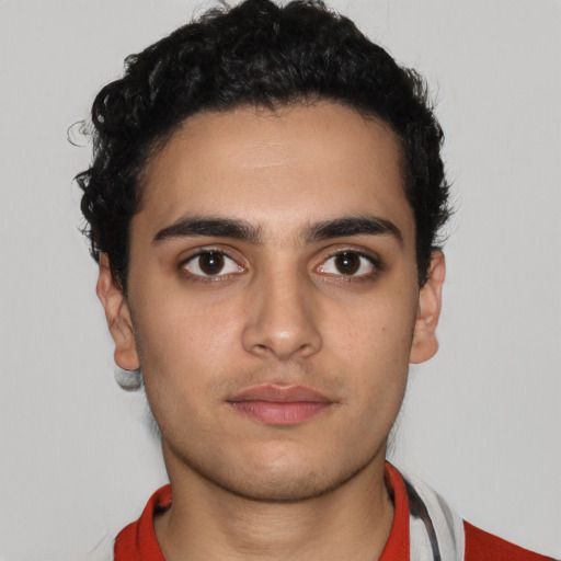 Neutral white young-adult male with short  black hair and brown eyes