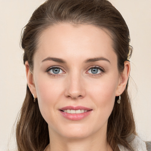 Joyful white young-adult female with medium  brown hair and grey eyes