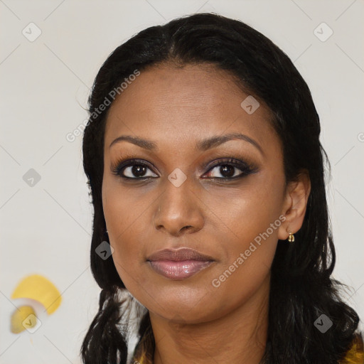 Joyful black young-adult female with long  black hair and brown eyes
