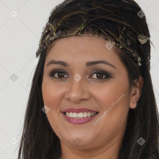 Joyful latino young-adult female with long  brown hair and brown eyes