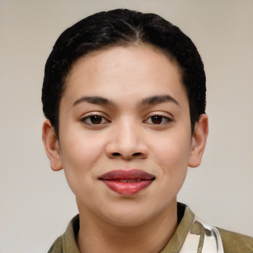 Joyful latino young-adult female with short  black hair and brown eyes