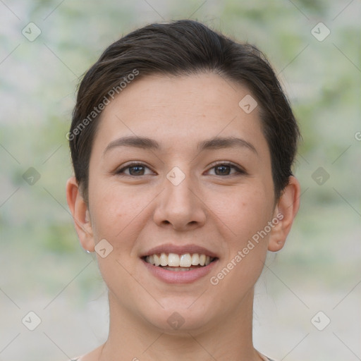 Joyful white young-adult female with short  brown hair and brown eyes