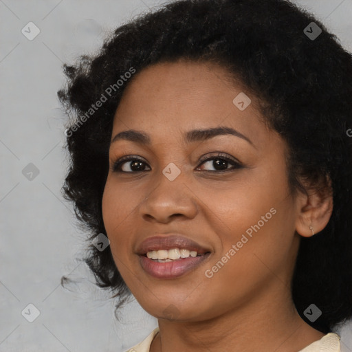 Joyful black young-adult female with medium  black hair and brown eyes