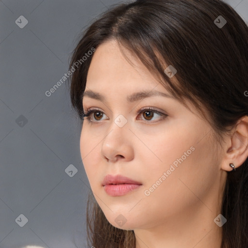 Neutral white young-adult female with long  brown hair and brown eyes