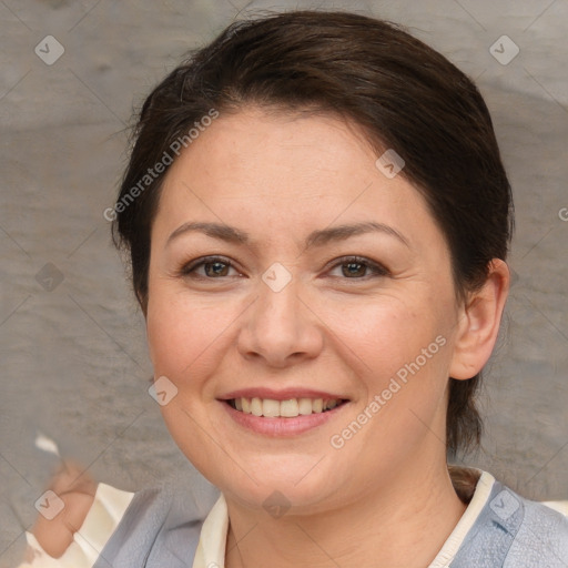 Joyful white adult female with short  brown hair and brown eyes