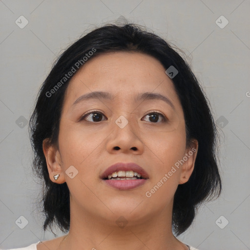 Joyful asian young-adult female with medium  brown hair and brown eyes