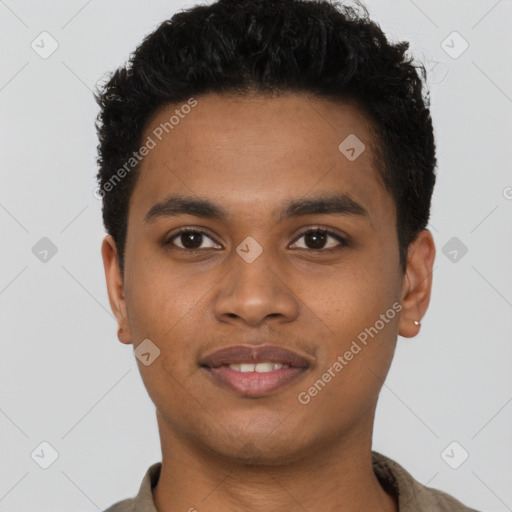 Joyful black young-adult male with short  brown hair and brown eyes