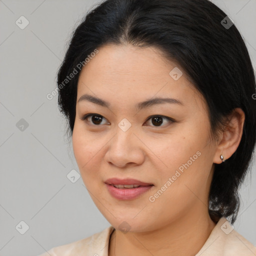 Joyful latino young-adult female with medium  brown hair and brown eyes