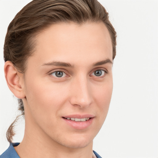 Joyful white young-adult female with short  brown hair and grey eyes