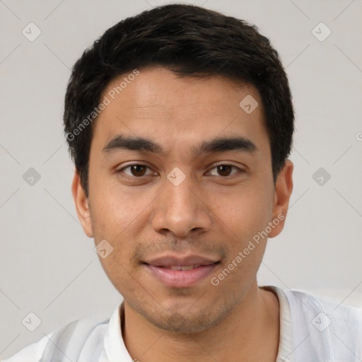 Joyful latino young-adult male with short  black hair and brown eyes