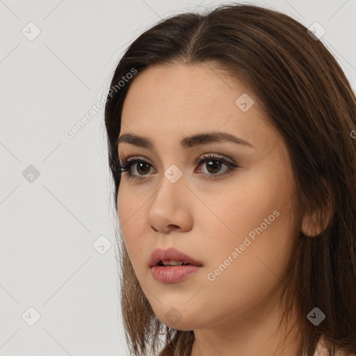 Neutral white young-adult female with long  brown hair and brown eyes