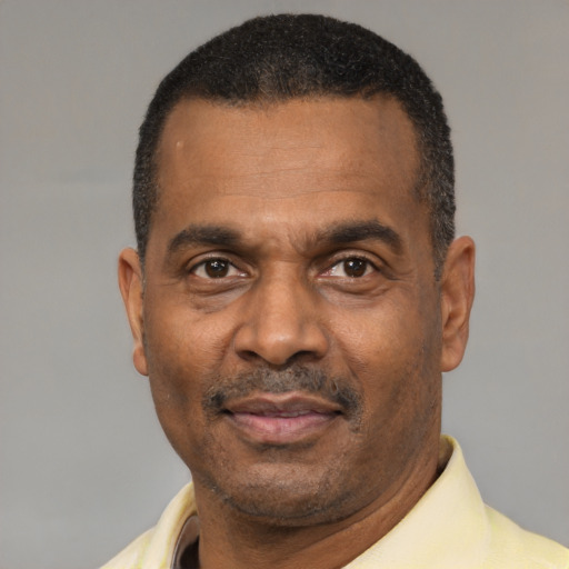 Neutral latino adult male with short  black hair and brown eyes