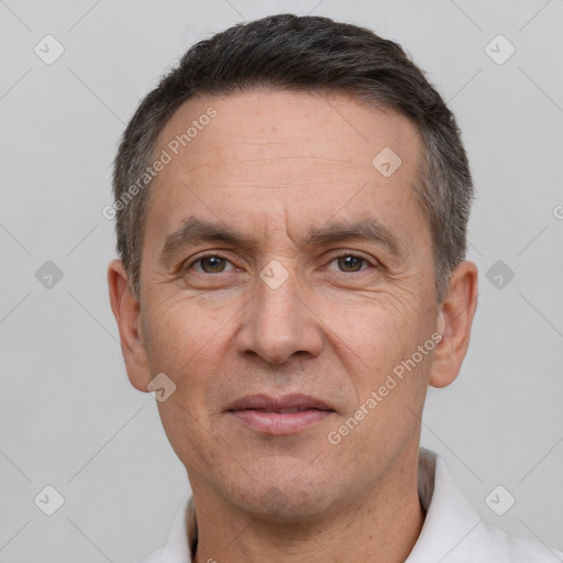 Joyful white adult male with short  brown hair and brown eyes