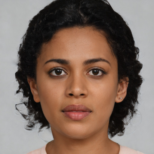 Joyful latino young-adult female with medium  black hair and brown eyes