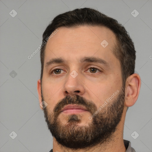 Neutral white young-adult male with short  black hair and brown eyes