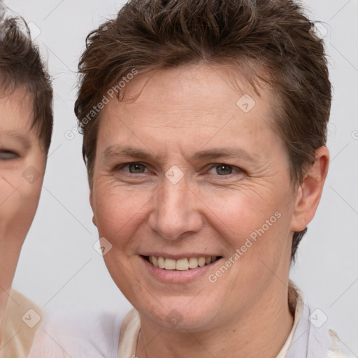 Joyful white adult female with short  brown hair and brown eyes