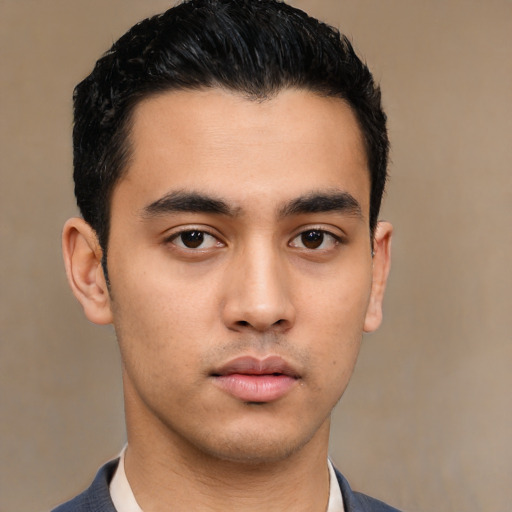 Neutral latino young-adult male with short  black hair and brown eyes
