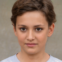 Joyful white child female with short  brown hair and brown eyes