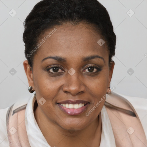 Joyful black young-adult female with short  brown hair and brown eyes