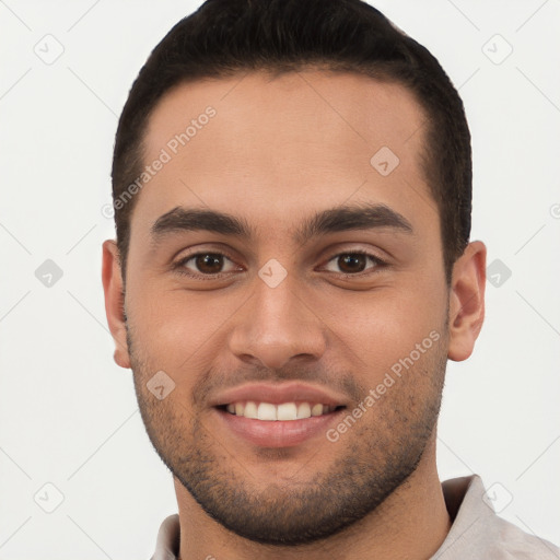 Joyful white young-adult male with short  brown hair and brown eyes