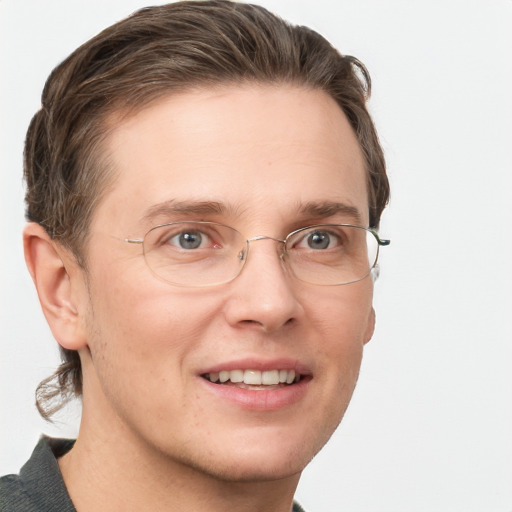 Joyful white adult male with short  brown hair and grey eyes