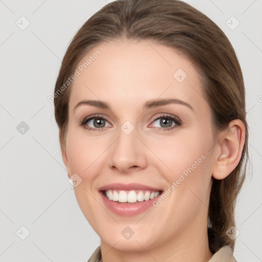 Joyful white young-adult female with medium  brown hair and grey eyes