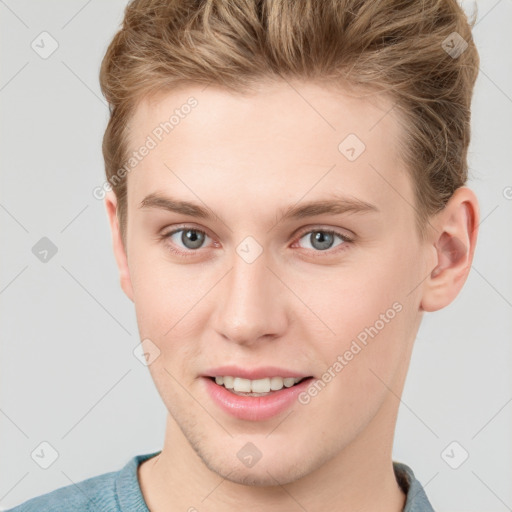 Joyful white young-adult female with short  brown hair and grey eyes