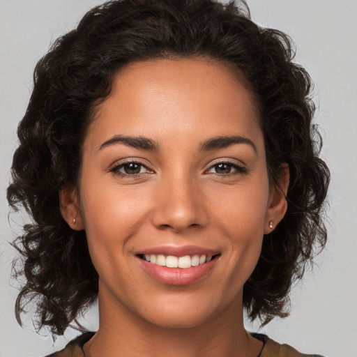 Joyful white young-adult female with medium  brown hair and brown eyes