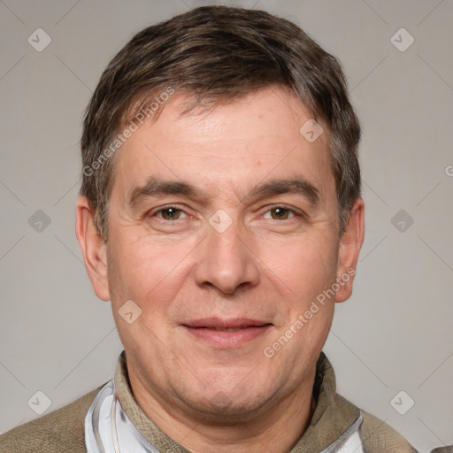 Joyful white adult male with short  brown hair and brown eyes