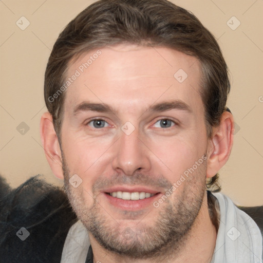 Joyful white adult male with short  brown hair and brown eyes