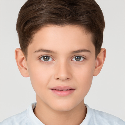 Joyful white child male with short  brown hair and brown eyes