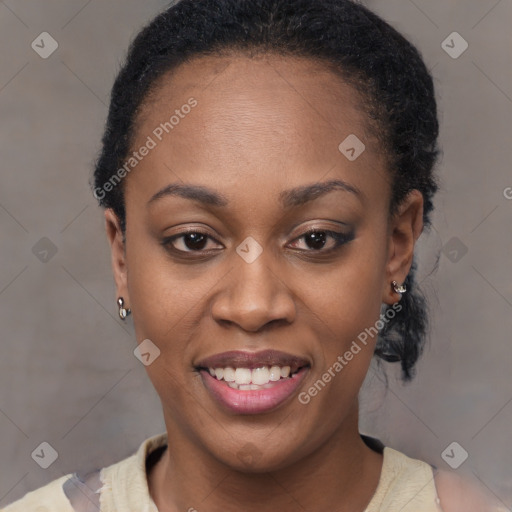 Joyful black young-adult female with short  brown hair and brown eyes