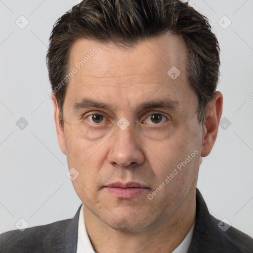 Joyful white adult male with short  brown hair and brown eyes