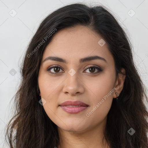 Joyful latino young-adult female with long  brown hair and brown eyes