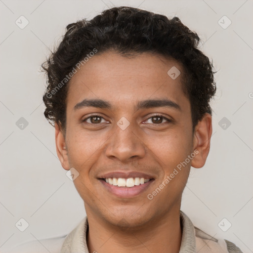 Joyful latino young-adult male with short  brown hair and brown eyes