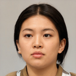 Neutral asian young-adult female with medium  brown hair and brown eyes