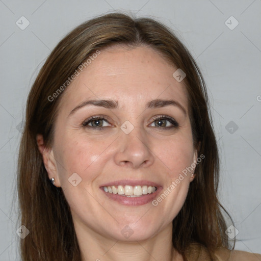 Joyful white adult female with medium  brown hair and grey eyes