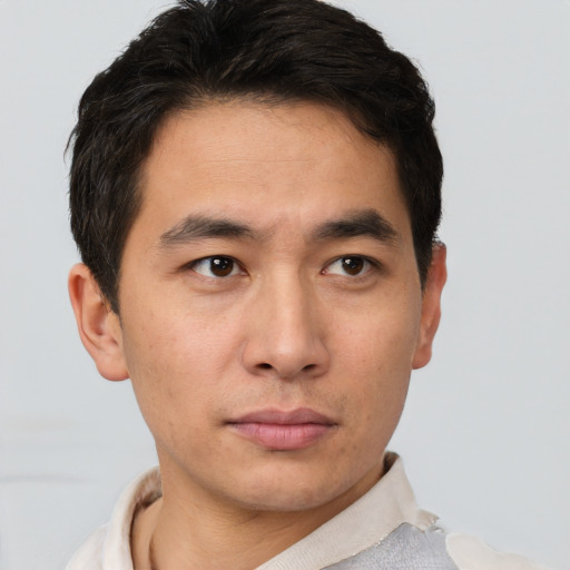 Neutral asian young-adult male with short  brown hair and brown eyes