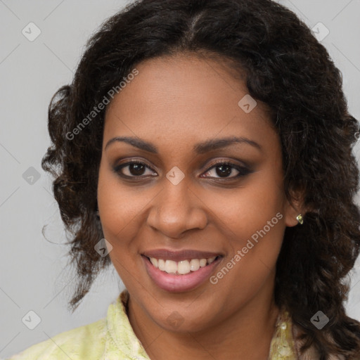 Joyful black young-adult female with long  brown hair and brown eyes