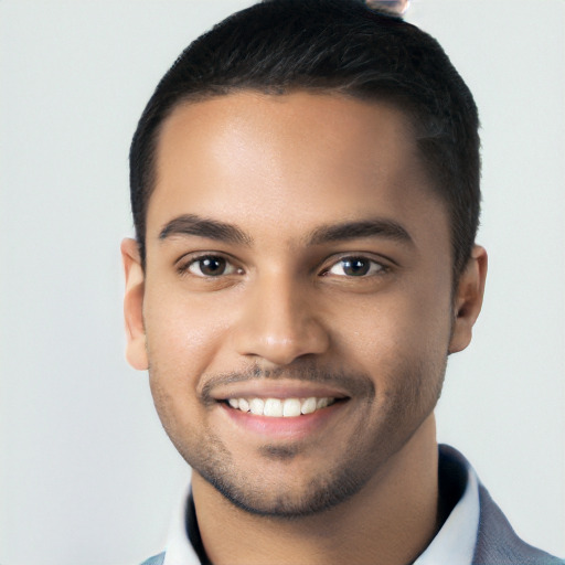 Joyful white young-adult male with short  black hair and brown eyes