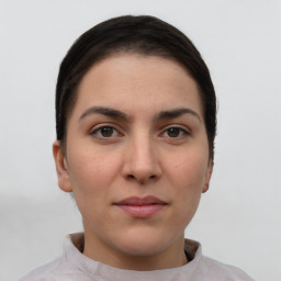 Neutral white young-adult female with short  brown hair and brown eyes