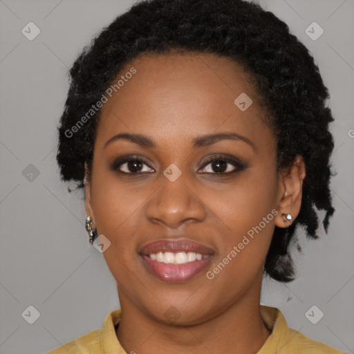 Joyful black young-adult female with long  black hair and brown eyes