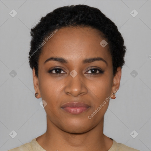 Joyful black young-adult female with short  black hair and brown eyes