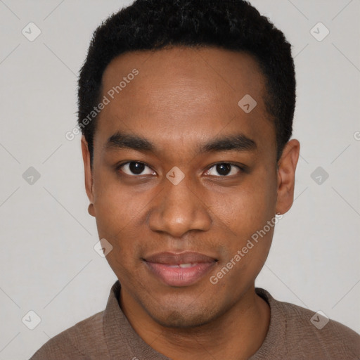 Joyful black young-adult male with short  black hair and brown eyes